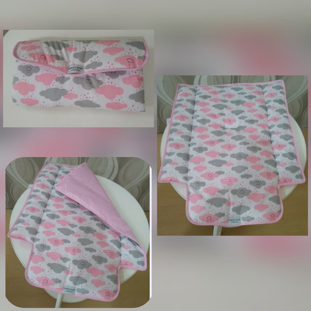 Trocador portátil de bolsa plastificado Nuvem rosa Menina