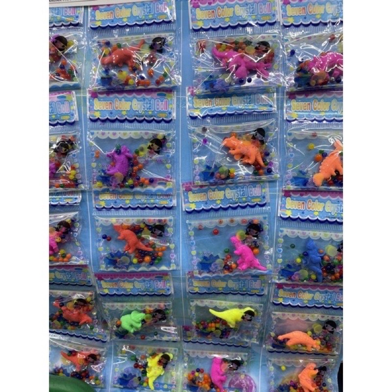 kit com 10 Bolinha de gel com mini dinossauro/bicho do mar cresce na água pra Enfeites !