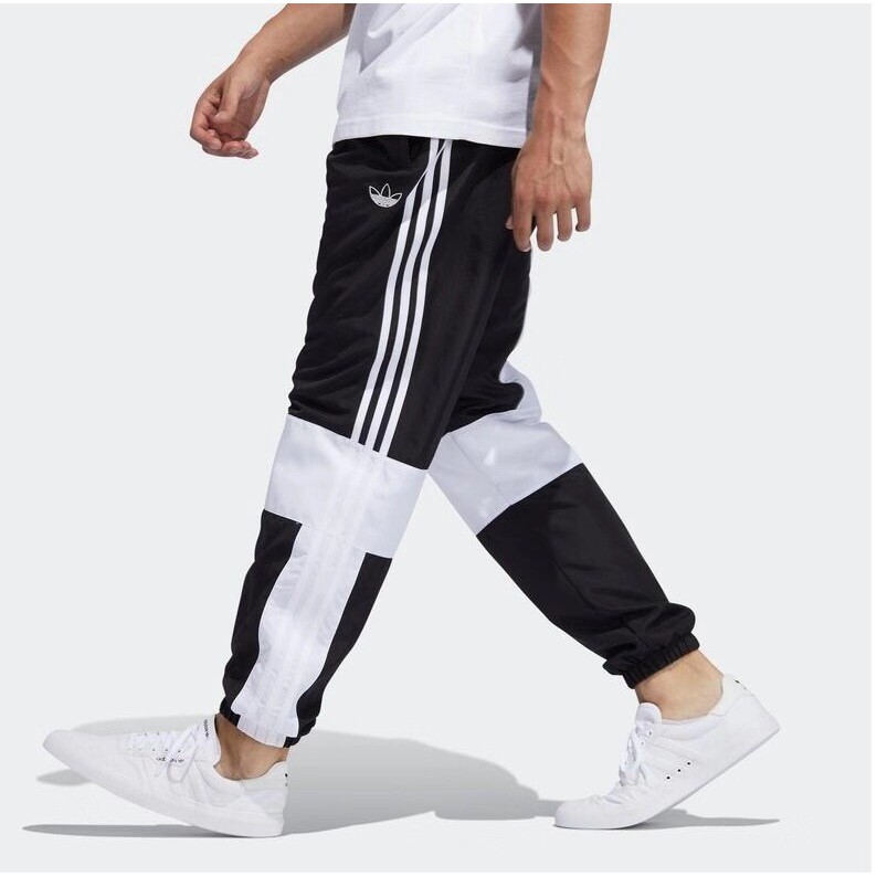 calça listrada adidas