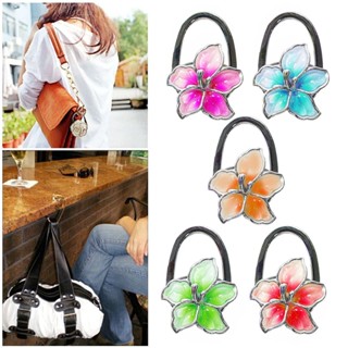 Suporte de Bolsa Flor Retrátil Dobrável para pendurar bolsa na mesa ao lado visando segurança em locais públicos em Oferta na Shopee