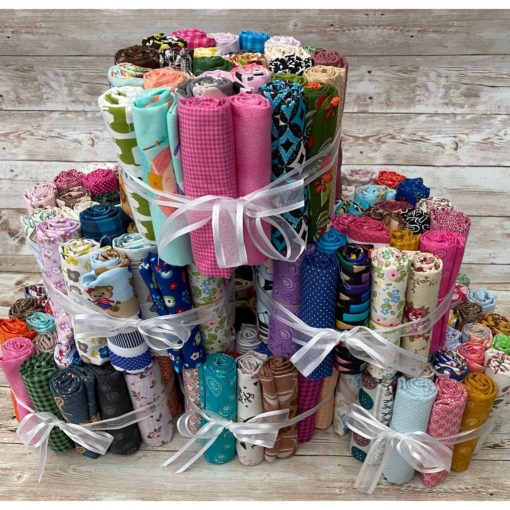 Tecido Tricoline 100% algodão 25 rolinhos sortidos medindo 35 (largura) x 50 (altura) cm cada. Melhores marcas