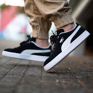 puma suede black and white on feet