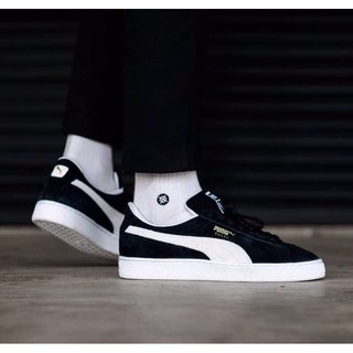 puma suede black and white on feet