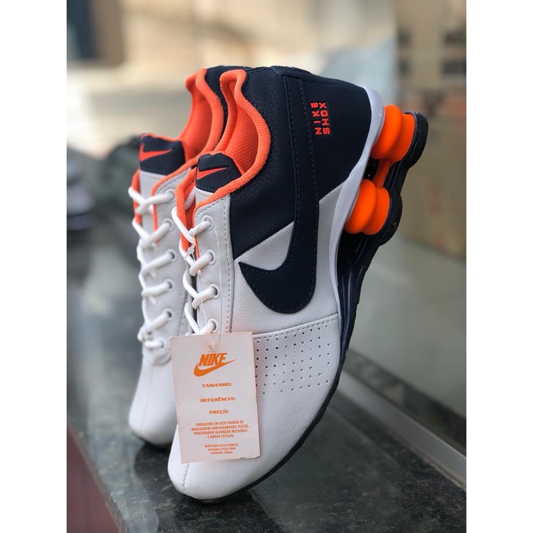 Nike 4 molas hot sale cinza e laranja