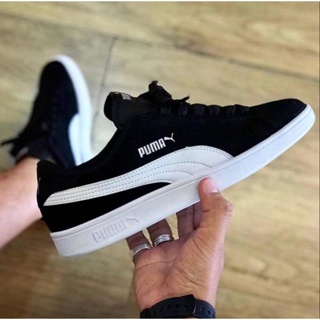 puma suede black and white on feet