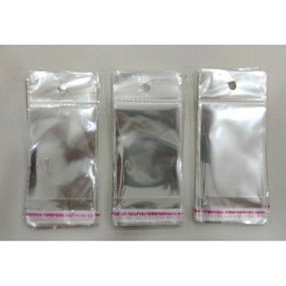 Saco adesivado com furo. Tam 5x7+3+3cm ou 5x8+3+3. 1000 unidades.
