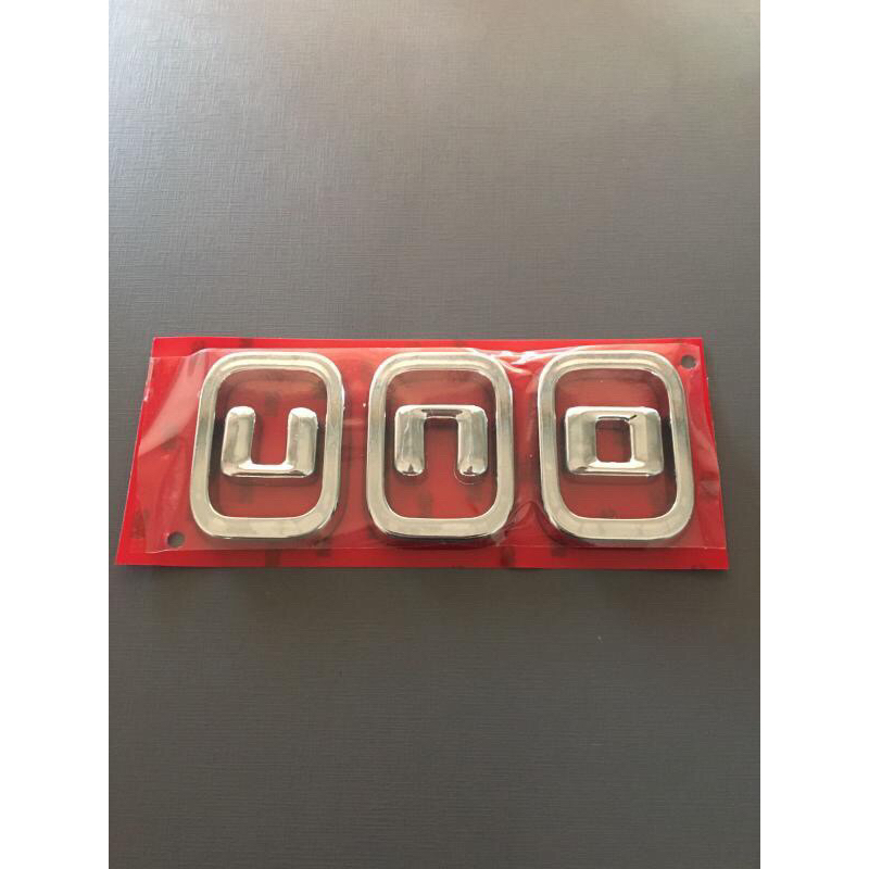 Emblema letreiro uno ano modelo 2011 acima fita 3M peça cromada