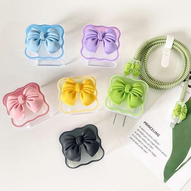 Capinha Protetora de Carregador e Cabo USB Iphone Design Laço Lacinho Coração Gatinho Cor Pastel em Oferta na Shopee