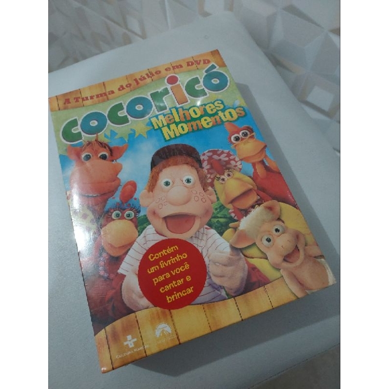 BOX DVD COCORICÓ MELHORES MOMENTOS A TURMA DO JÚLIO LACRADO  Contém um livrinho para você cantar e brincar