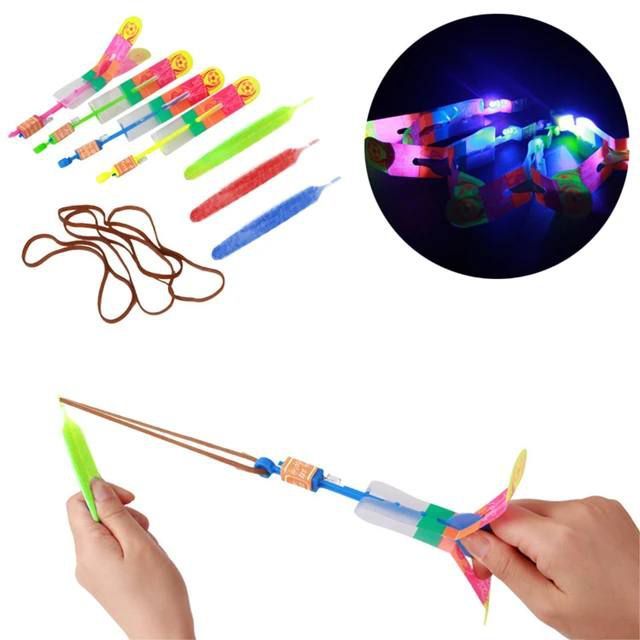Brinquedo Estilingue Elástico Rotativo com LED Voador/Helicóptero Flecha de iluminação Para Sacola Supresa