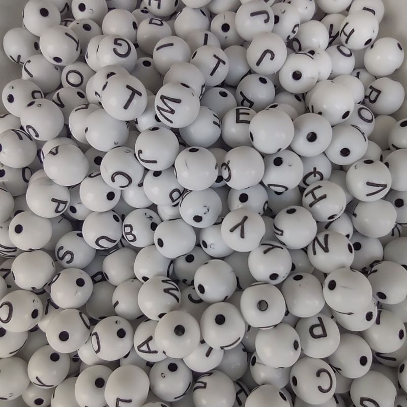 MIÇANGA INFANTIL LETRAS BRANCA COM PRETA FORMATO BOLA Aprox. 1200 UNID.