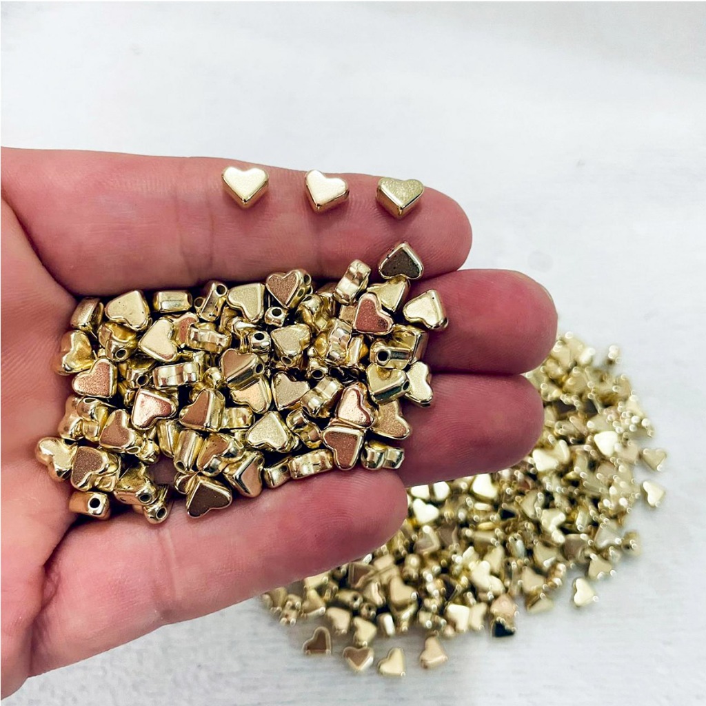 Coração Dourado abs 6mm miçanga Entremeio - 20g aprox 228pçs em Oferta na Shopee