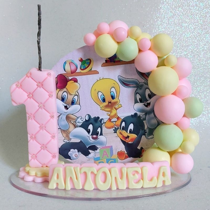 vela cenário baby looney tunes menina rosa em Oferta na Shopee