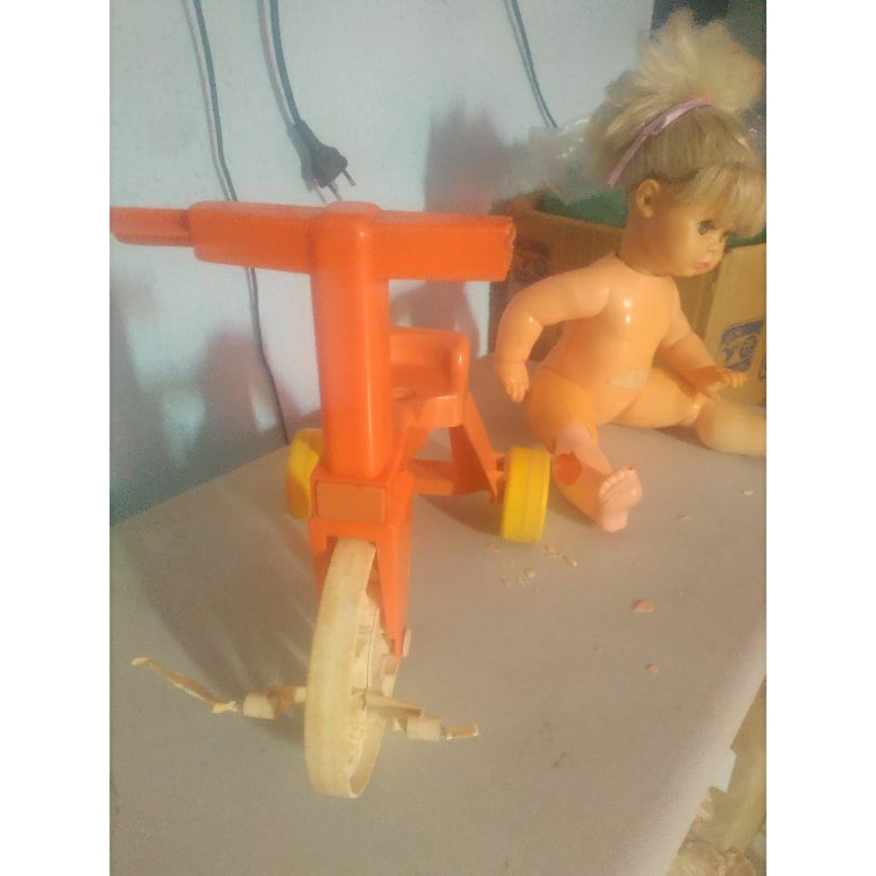 boneca Tippy com triciclo Restaurar