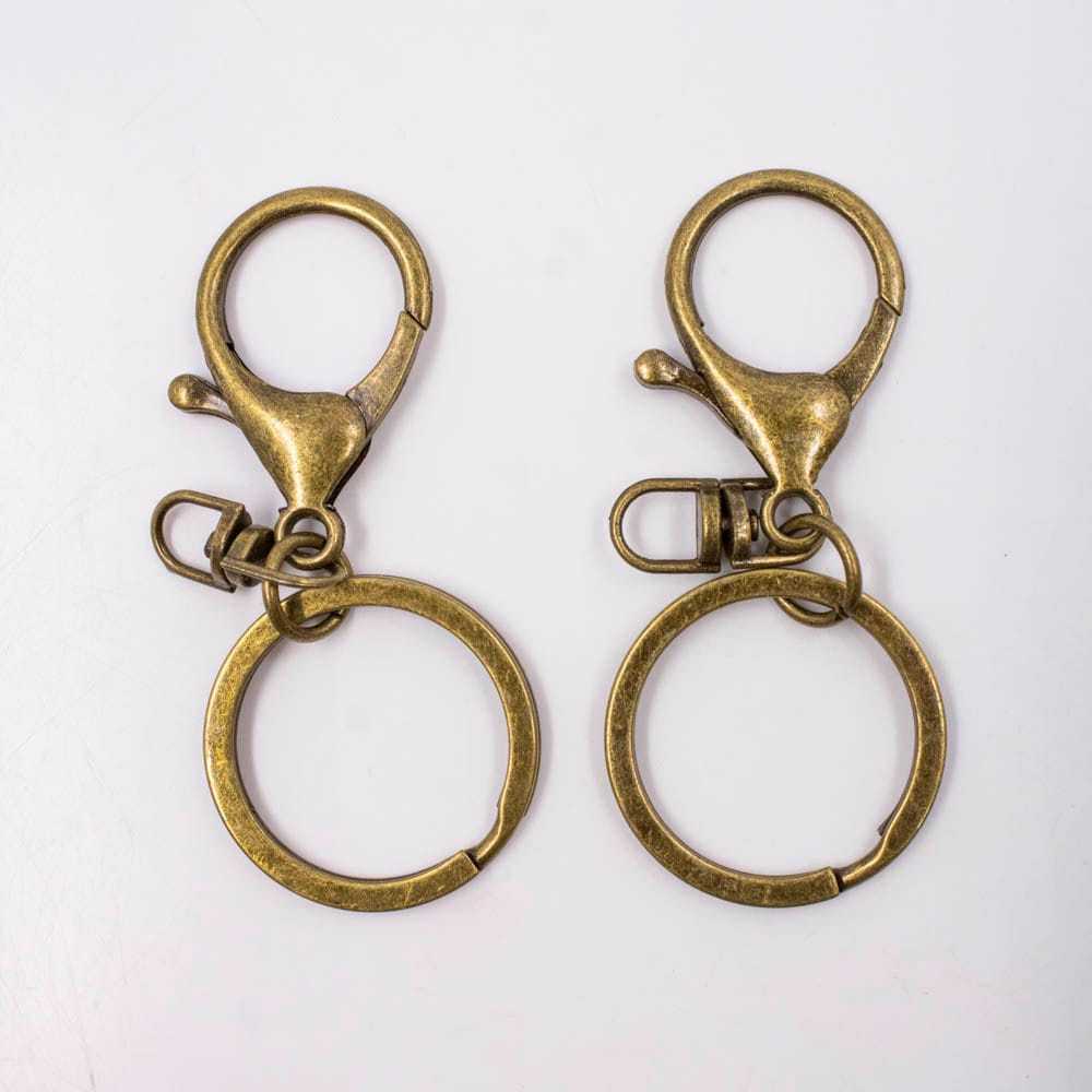 FECHO LAGOSTA 36MM COM CONECTOR E ARGOLA 30MM EM ZAMAC COM 10 NACOR OURO VELHO