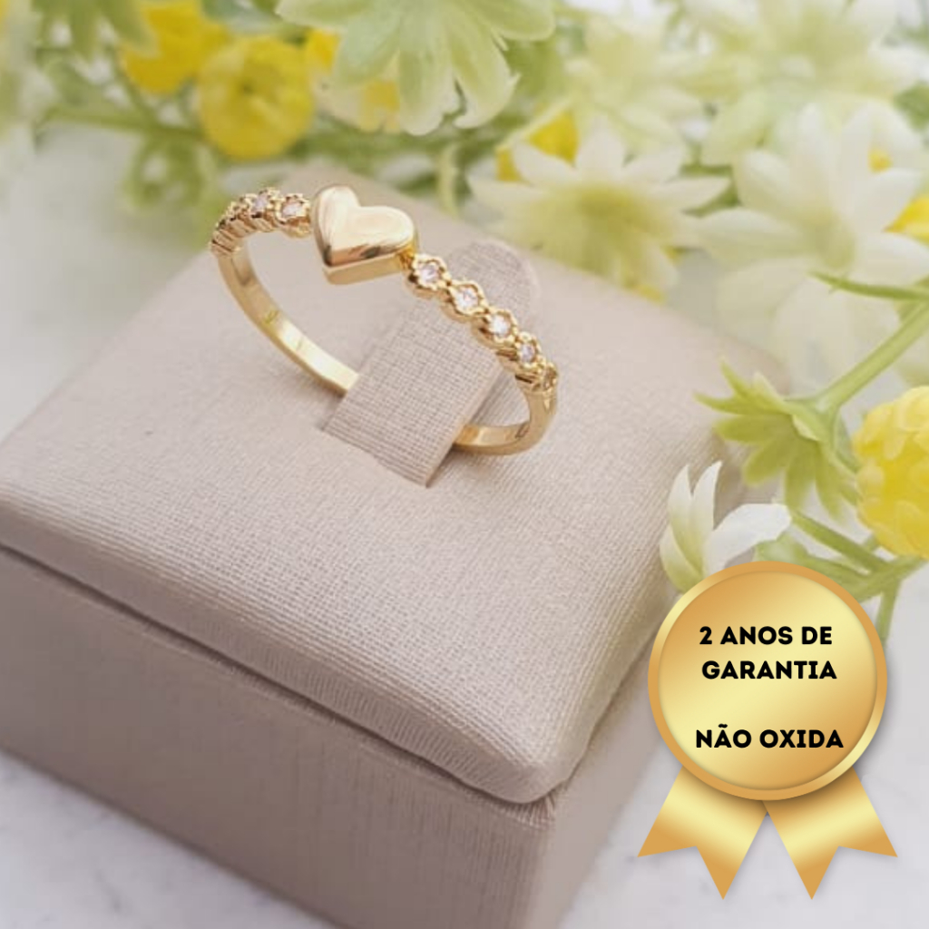 Anel coração e mini flores com zircônias, banhado a ouro 18K, com 2 anos de garantia. Cód. AN245