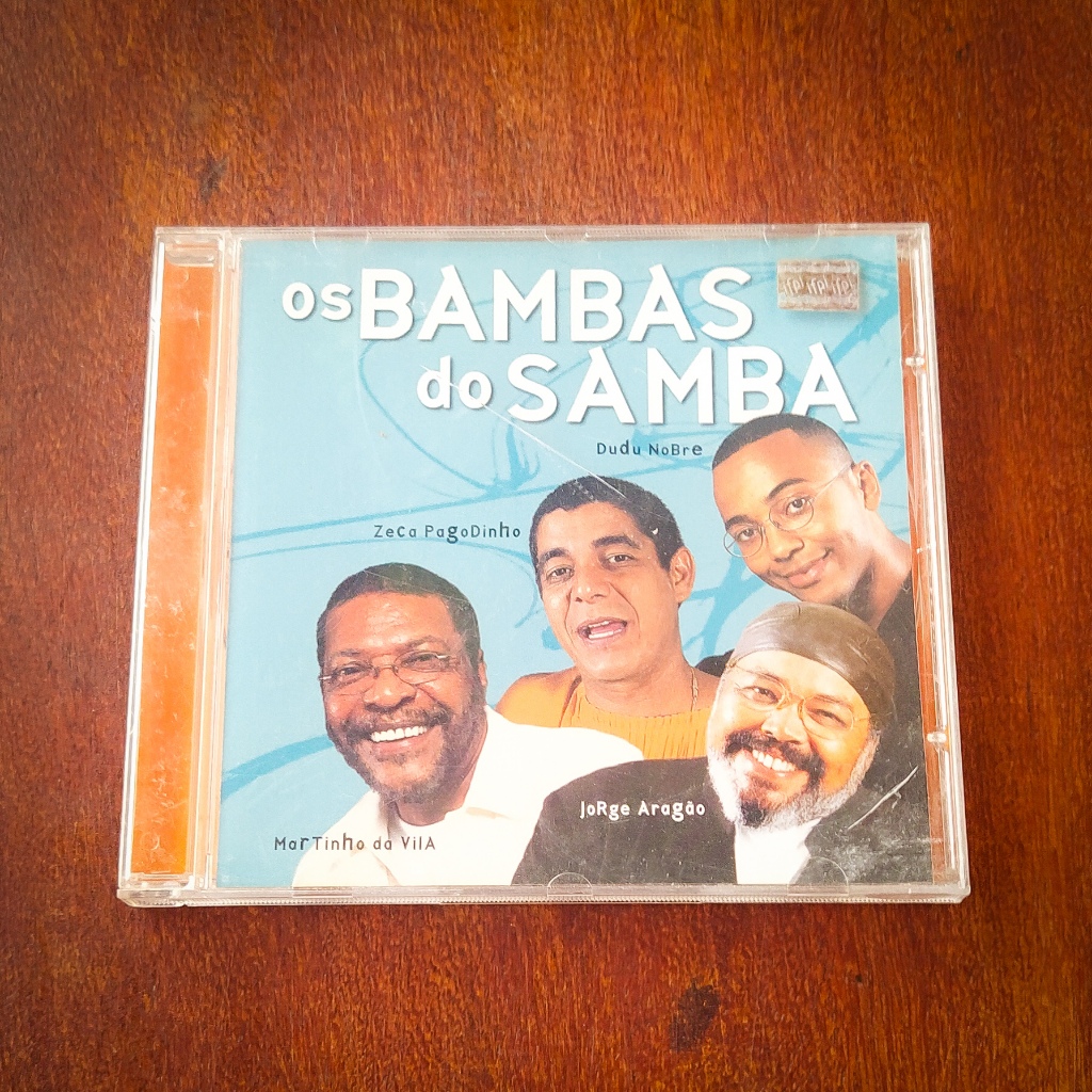 CD OS BAMBAS DO SAMBA / ORIGINAL ZECA PAGODINHO, DUDU NOBRE, MARTINHO DA VILA, JORGE ARAGÃO PAGODE SAMBA LOCADORA COLEÇÃO SHOW MUSICA RADIO