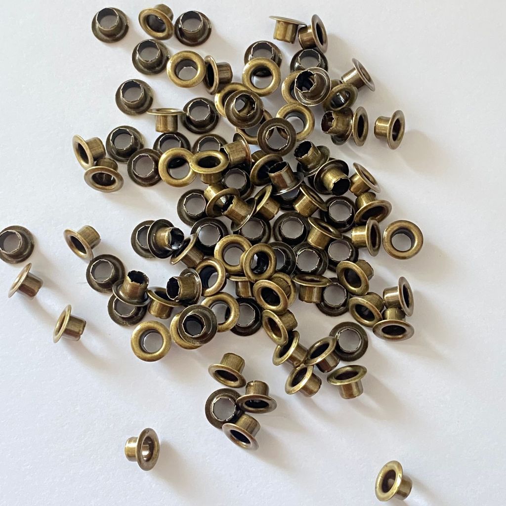 200 Ilhós REF 54   Para encadernação na Cor Ouro Envelhecido em Oferta na Shopee