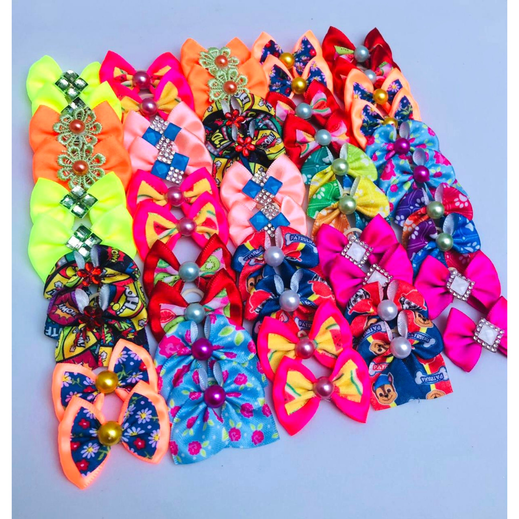 50 unidades lacinhos para pet cores variadas cachorro, caes laço banho e tosa em Oferta na Shopee