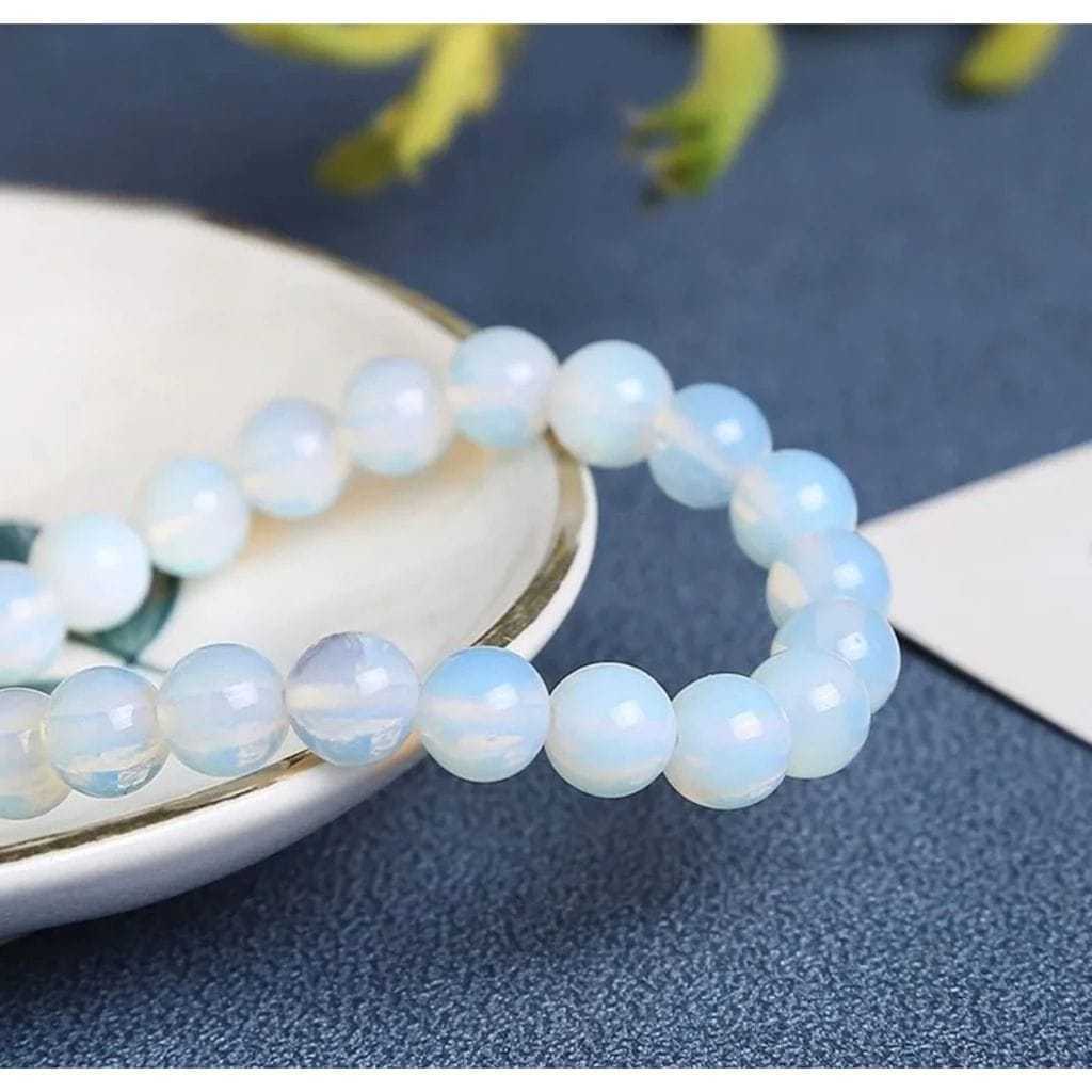 Pulseira De Pedra Da Lua Esfera Tamanho 8 mm  Proteção Espiritual e ajuda no equilíbrio emocional. em Oferta na Shopee