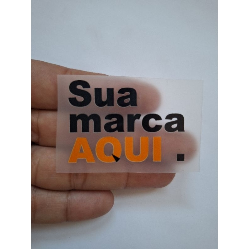 Etiquetas termocolantes com sua logo para marcas de roupa em Oferta na Shopee