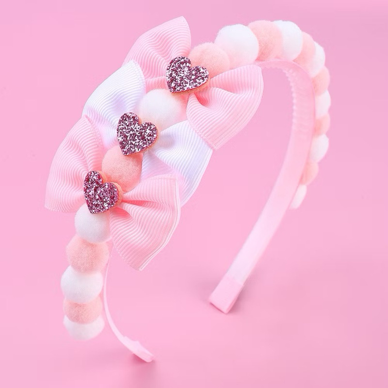 Arquinho Rosa com bolinhas pom pom e laço para meninas  crianças de 2 até 12 anos