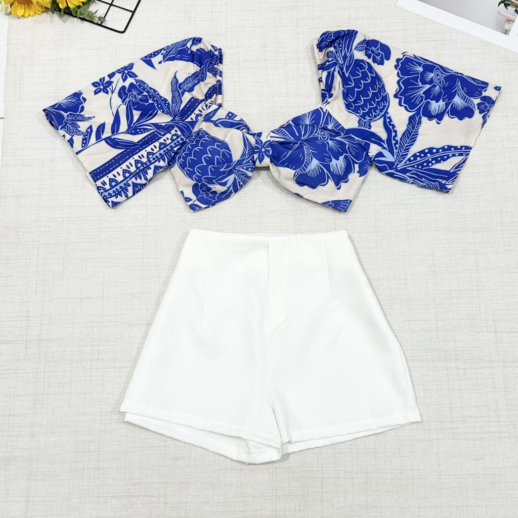 Conjunto camisa com tamanho unico da pra amarra atras com elastano e com estampa  short com ziper sem bolso