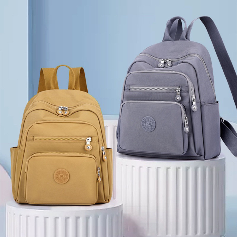 Mochila Casual  Moda Nylon Pano Escolar Feminina Leve Cor Sólida Simples Viagem Média em Oferta na Shopee