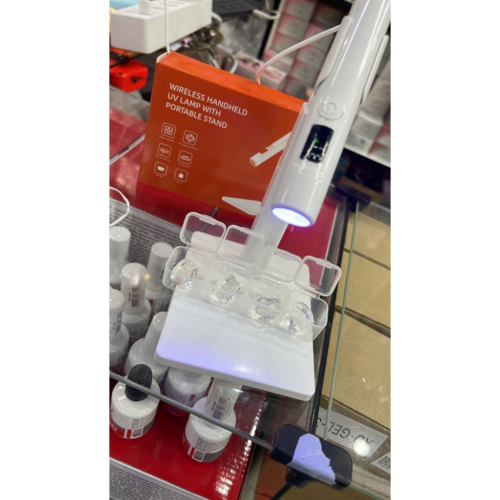 Imagem lanterna portatil com suporte led uv