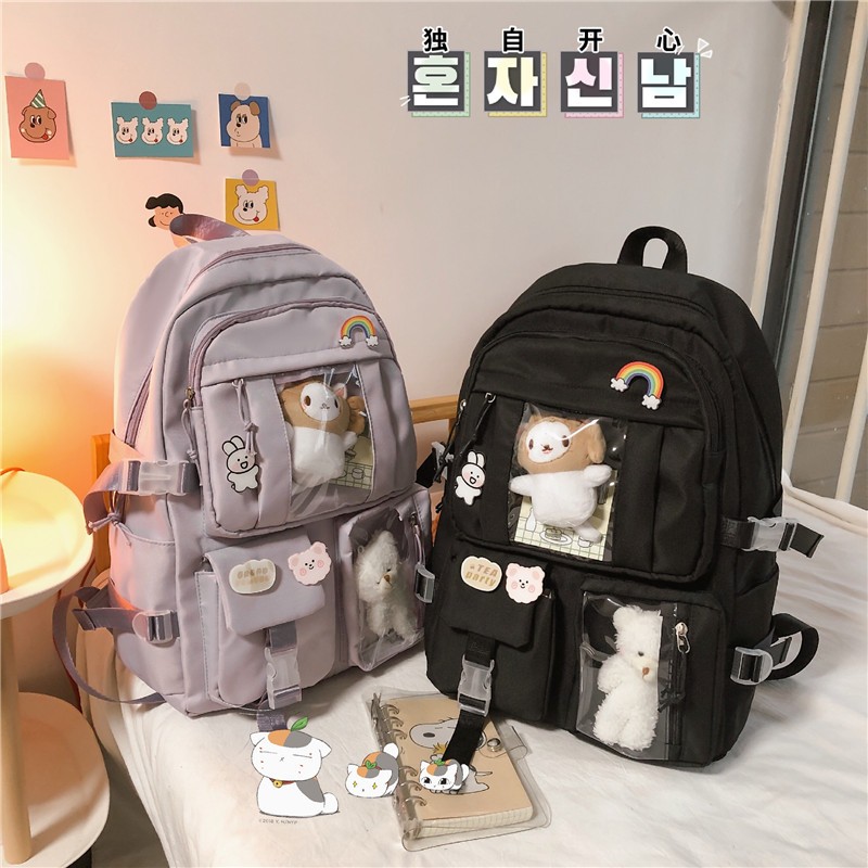 Mochila Feminina Escolar Passeio Coreano Grande Capacidade Com pingente de urso Mochila versátil popular nas redes em Oferta na Shopee