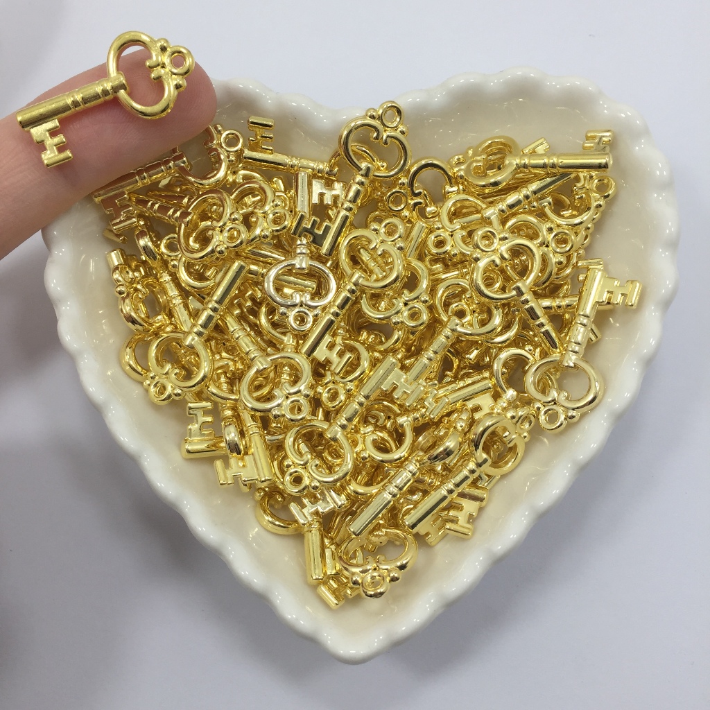 Pingente Chave ABS Dourada 2,6cm x 1,3cm 20 Unidades