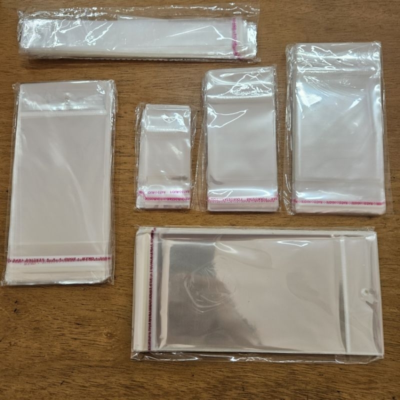 100un Embalagens adesivadas com furo em Oferta na Shopee