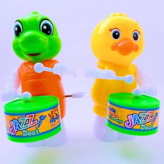 Brinquedo Movido a Corda Infantil Toca Tambor Dinossauros Patinho em Oferta na Shopee