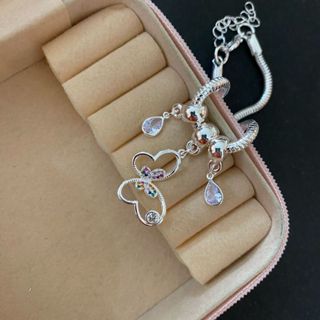 PULSEIRA COM BERLOQUES DE BORBOLETA FOLHEADO A PRATA 925