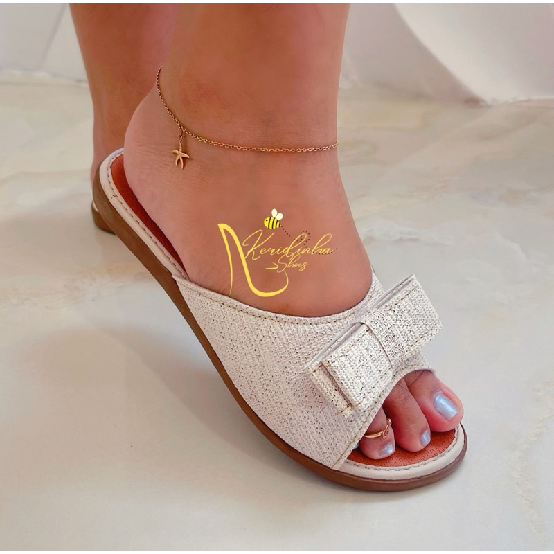 Rasteirinha feminina plana de laço