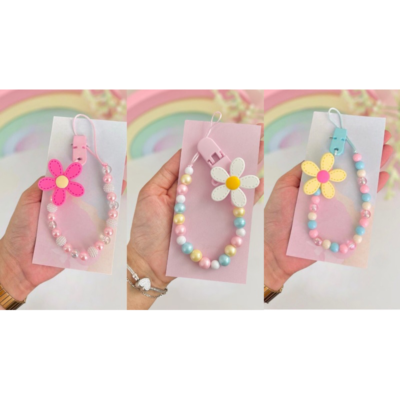 Prendedor de chupeta Flores novidade em Oferta na Shopee