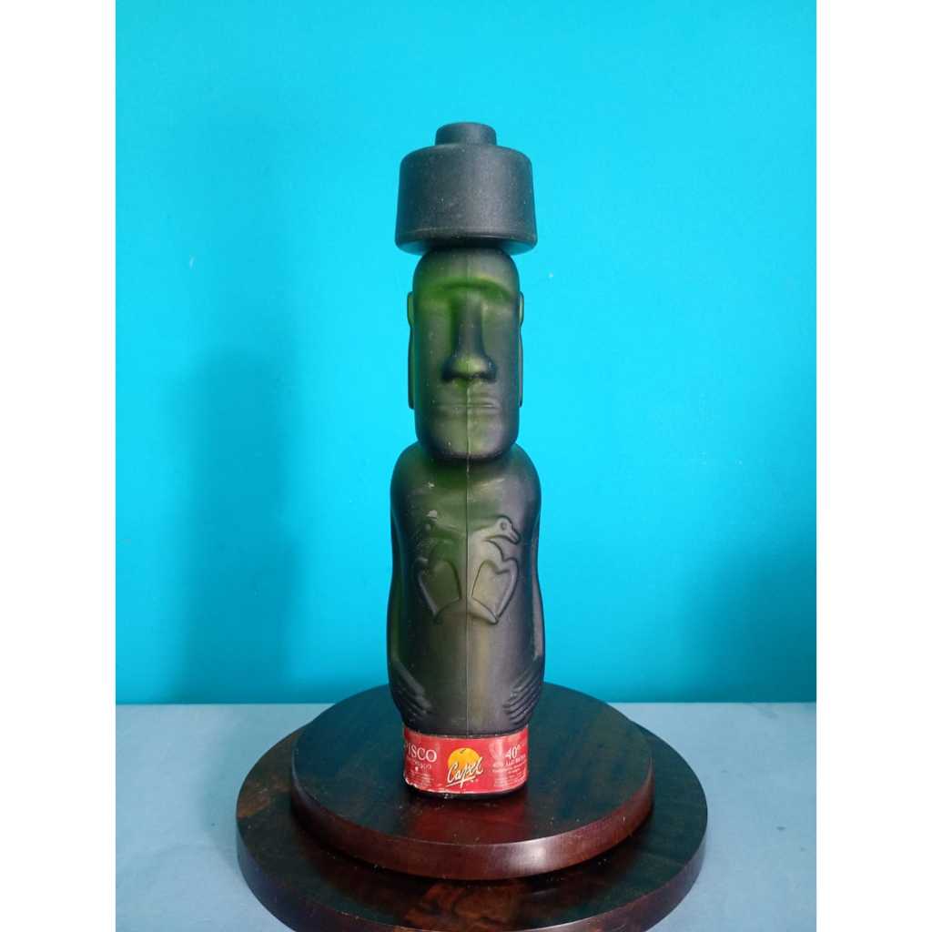 Antiga garrafa de vidro Pisco Reservado Moai