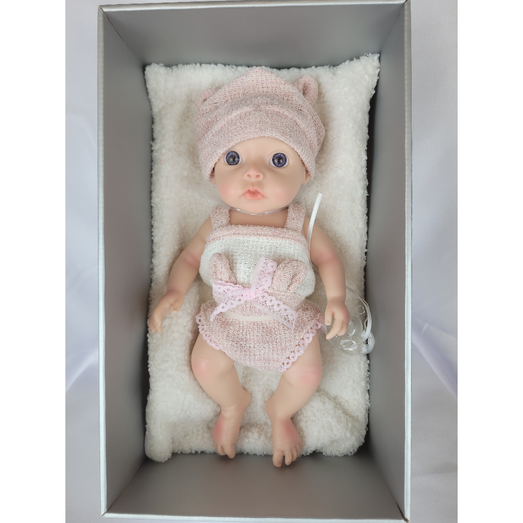 Bebê Reborn de olhos abertos roupa rosa - Toys Import 24012228