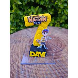 VELA DE BISCUIT PERSONALIZADA, NATAN POR AI COM NOME  E PAVIO em Oferta na Shopee