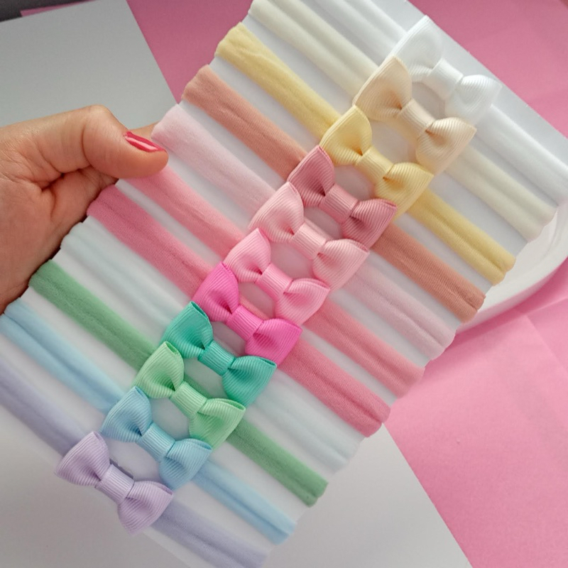 Laços kit Mari com 11 Cores, lacinhos para bebês na meia de seda em Oferta na Shopee