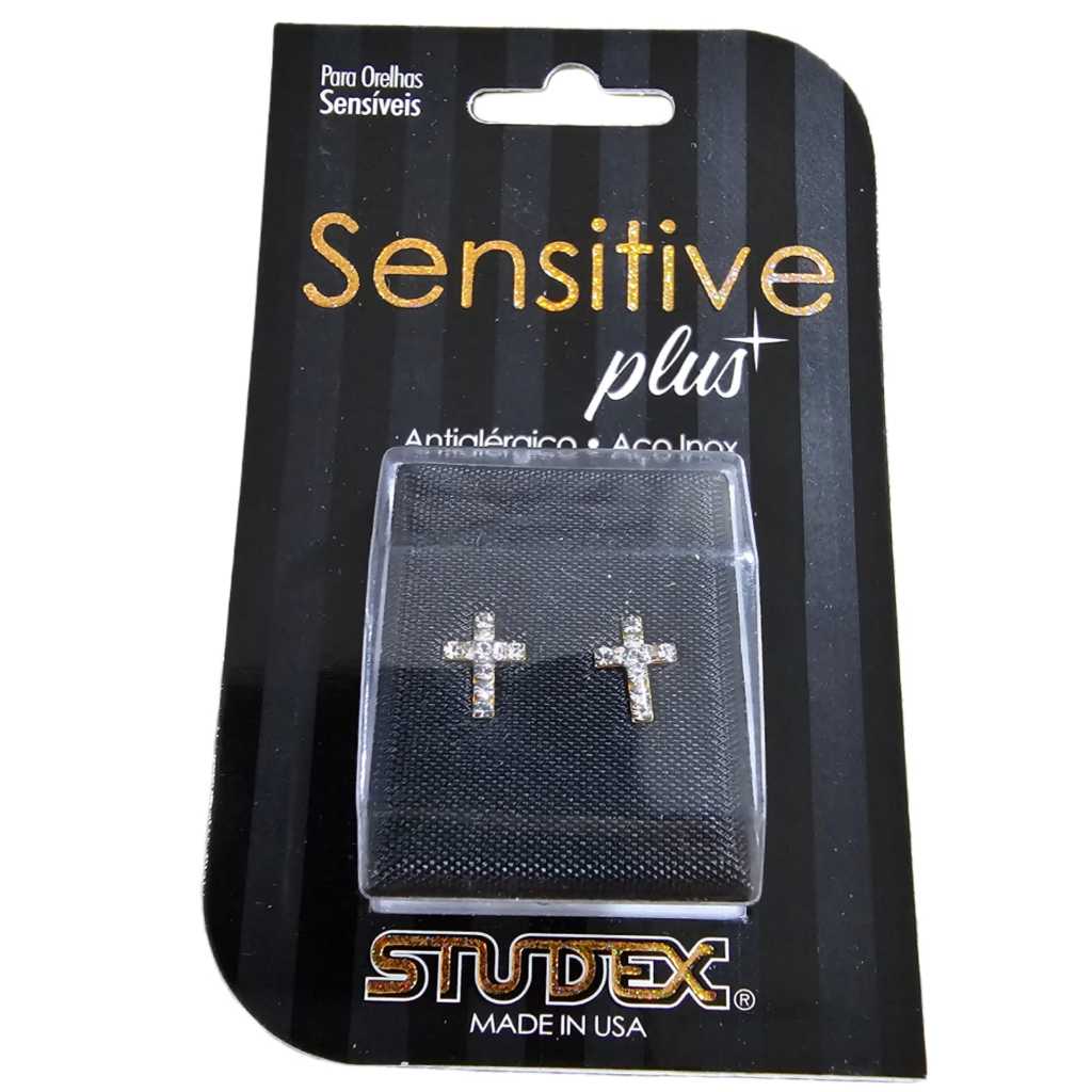 BRINCO STUDEX SENSITIVE PLUS CRUZ CRISTAL SP3604Y em Oferta na Shopee