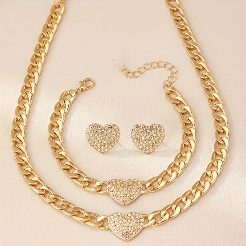 Novo conjunto feminino de colar, pulseira e brincos com pingente de coração cravejado de diamantes e corrente grossa.