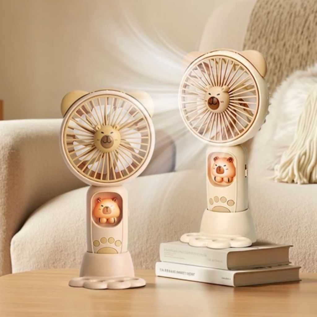 Mini ventilador portátil de mão ou de mesa com desenho capivara, luz LED e base com pata com recarregável USB-A-08 em Oferta na Shopee