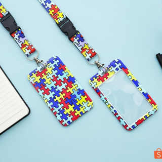 Cordão de Identificação Autista com Crachá | Estampa Quebra-Cabeça – Conscientização e Inclusão em Oferta na Shopee
