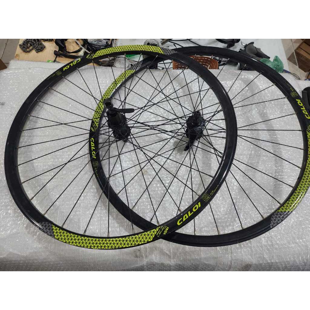 par de rodas caloi vzan aero com cubos shimano 700 urbana para freio a disco de bike desmontada city evibe
