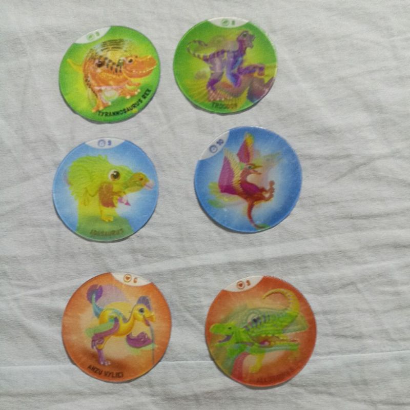 (Lote 125) - Lote com 6 Tazos / Figurinhas Ozmo ano 2024