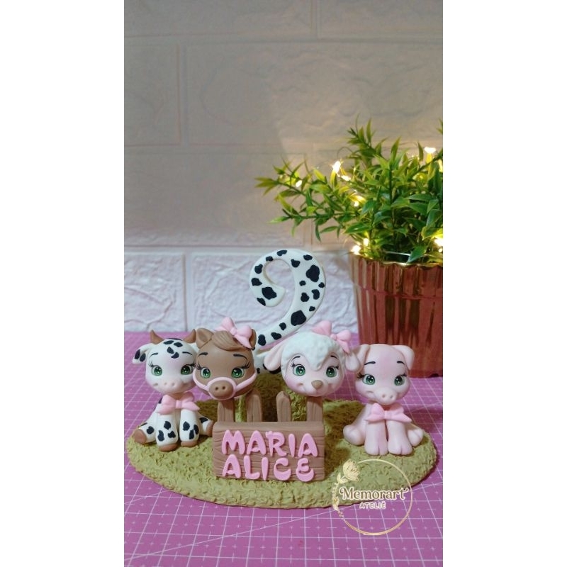 Vela personalizada fazendinha em biscuit