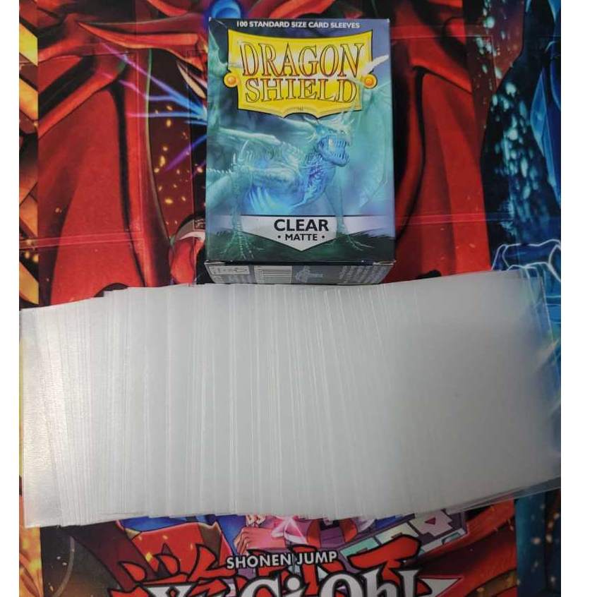 Sleeve/Protetor de Cartas DRAGONSHIELD CLEAR MATTE SEMI/PRATICAMENTE-NOVO100 Unidades.Para POKEMON/MAGIC. SEM A CAIXINHA