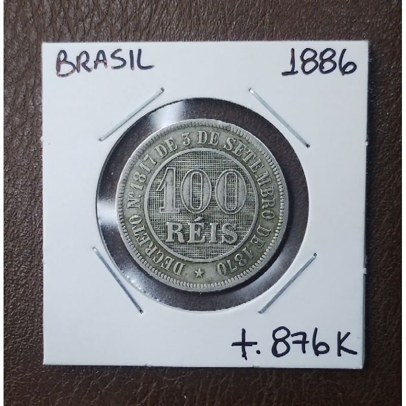 Moeda do Brasil 100 Réis 1886 MBC. Do Império com Brasão de Dom Pedro II e Decreto de 1870. Peça histórica real.