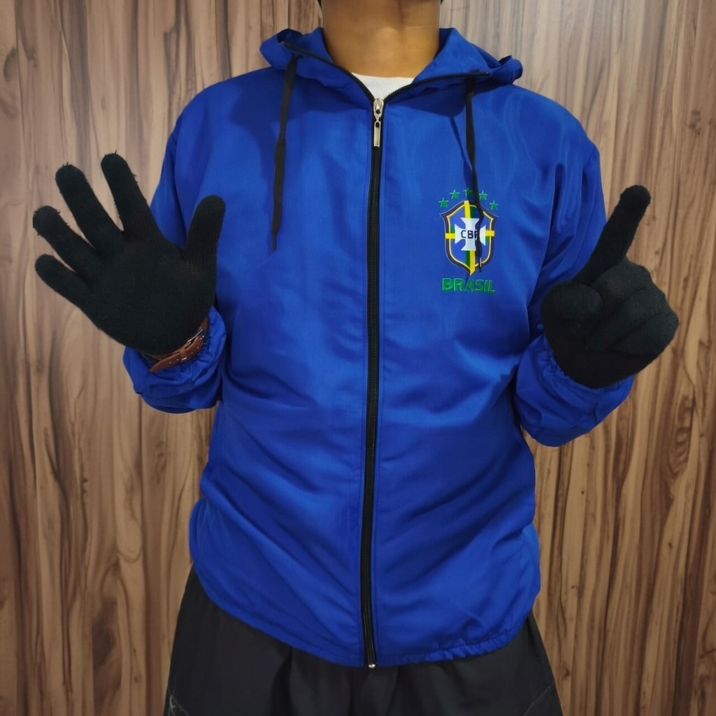 Vista a Garra do Hexa: Corta-Vento Brasil 2026 – Modelagem Ampla e Estilo Único!"